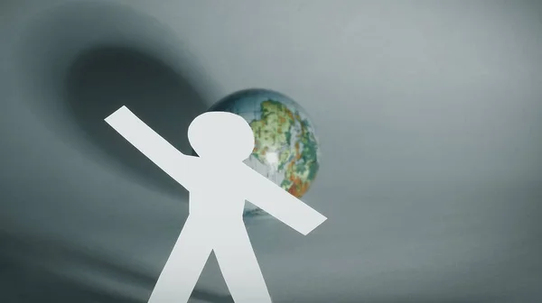 Élégant homme de papier debout près du globe — Photo