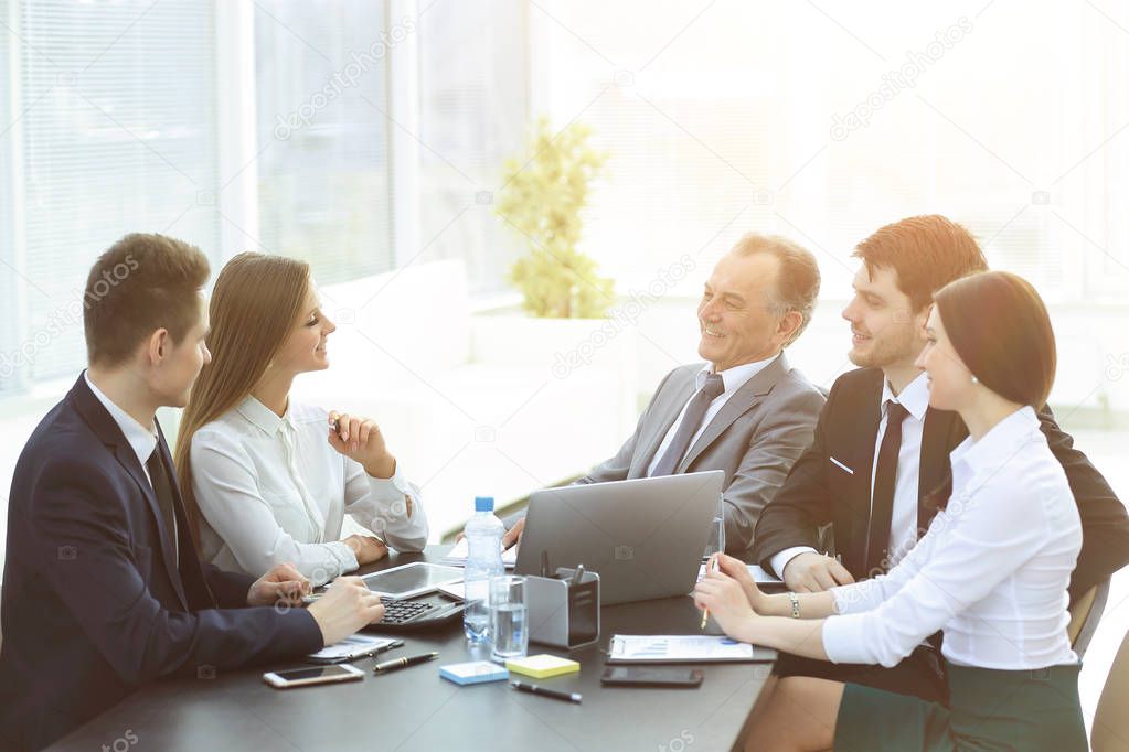 business colleagues talking at Desk in the office