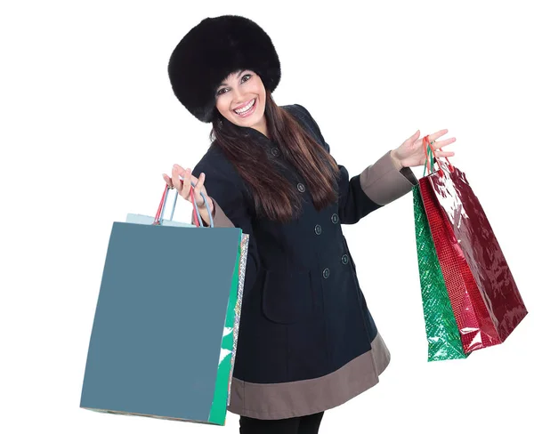 Jovem mulher em roupas de inverno com sacos de compras — Fotografia de Stock