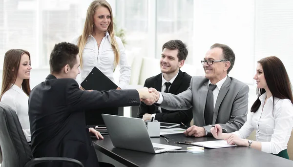 Business partners shaking hands after a successful transaction — Stock Photo, Image