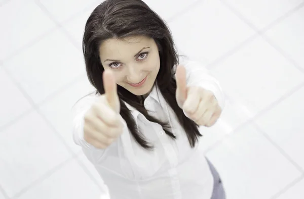 Vista desde el top.in completo growth.successful mujer de negocios mostrando pulgar hacia arriba —  Fotos de Stock