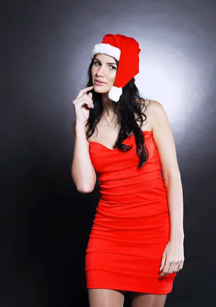 Woman in costume of Santa Claus showing to copy space — Stock Photo, Image