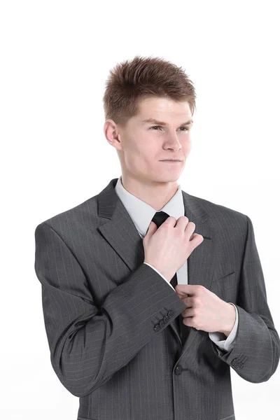 Jovem empresário ajustando seu tie.isolated em um branco — Fotografia de Stock