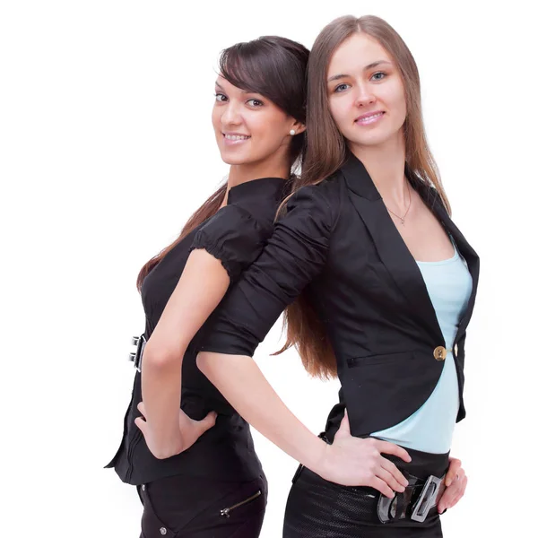 Two successful business women standing back to back. — Stock Photo, Image