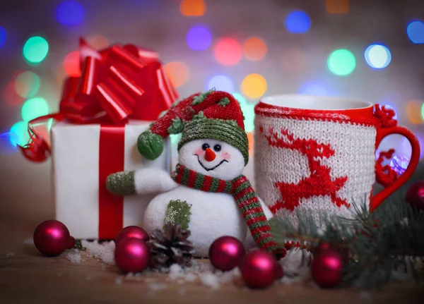 Christmas card.toy snowman and cute gifts — Stock Photo, Image