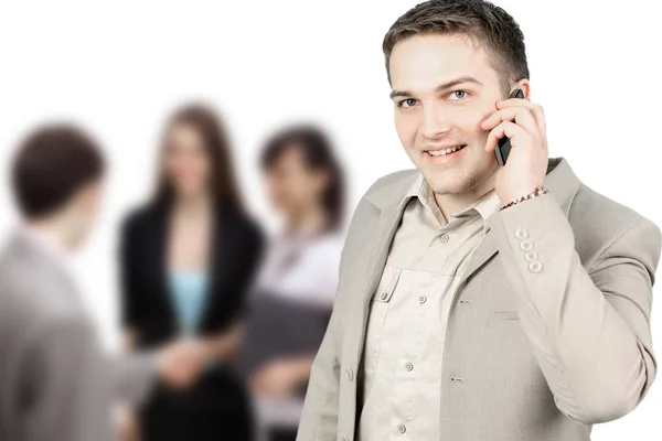 Jonge lachende zakenman opgeroepen telefoon geïsoleerd op wit — Stockfoto