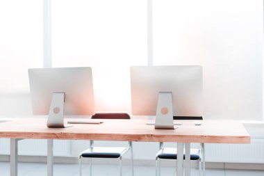 close up. workplace with computers on the table in an empty office.