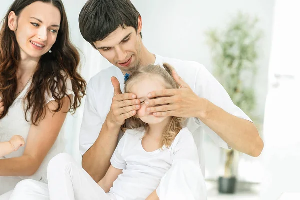 Modern happy family on a Sunday in the nursery — Stock Photo, Image