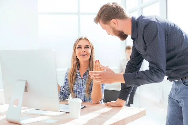 Young employees discussing online news in the office — 스톡 사진