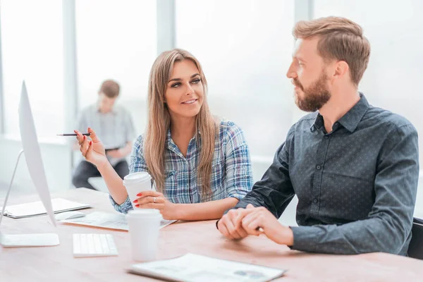 young employees discussing the information coming to the office.
