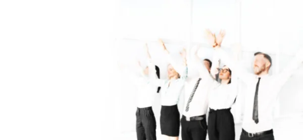 Blurred image for the advertising text. photo with copy space. business team showing their success with hands up. — ストック写真