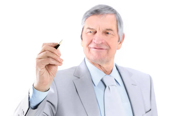 Mature businessman showing a pencil on the copy space. — Stock Photo, Image