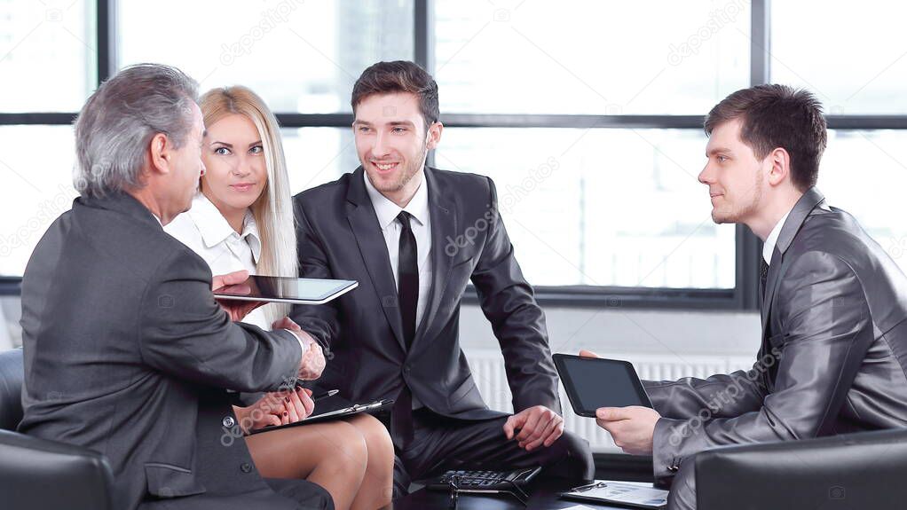 business partners approving the transaction with a handshake