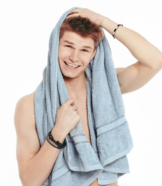 Young man with towel relaxing after shower. — Stock Photo, Image