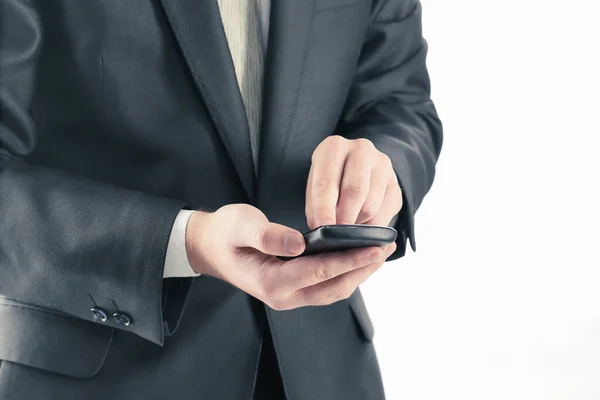 Close up. businessman typing SMS on smartphone — Stock Photo, Image