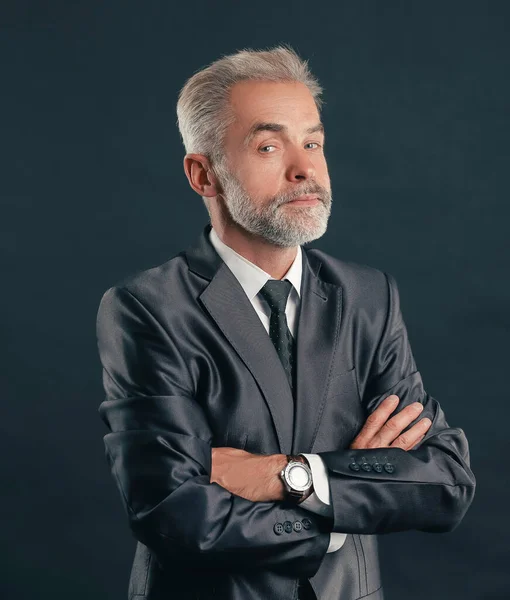 Portrait of a senior businessman.isolated on dark background — Stock Photo, Image