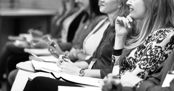 Business woman on the background of colleagues in the conference. black and white photo — Stock Photo, Image