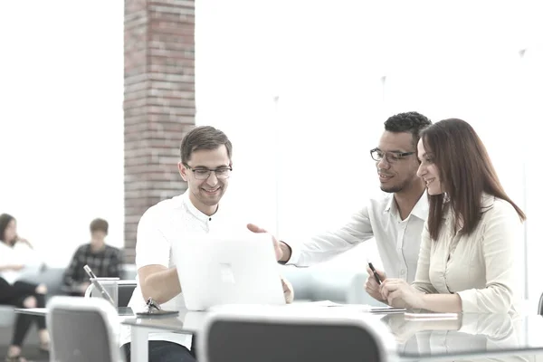 business team discussing online information at work meeting