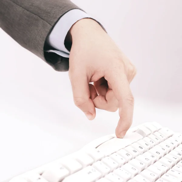 Closeup. businessman press a key on the computer keyboard. — Stock Photo, Image