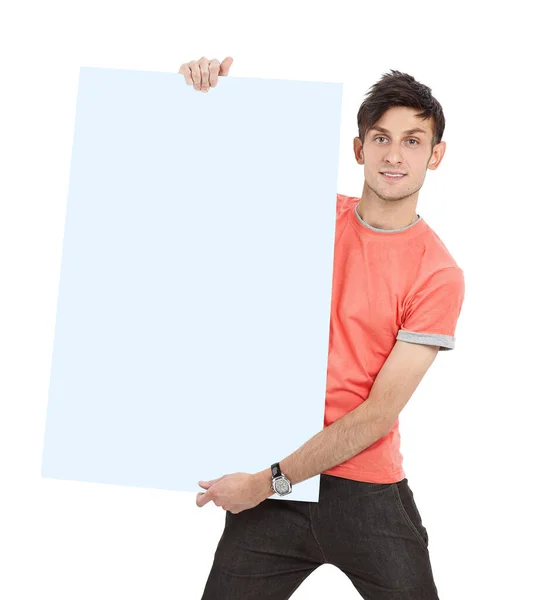 Ragazzo moderno in una camicia gialla che mostra poster bianco — Foto Stock