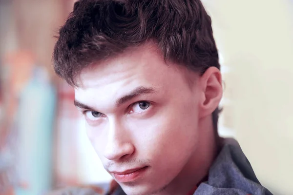 Close up. young guy looking at camera — Stock Photo, Image