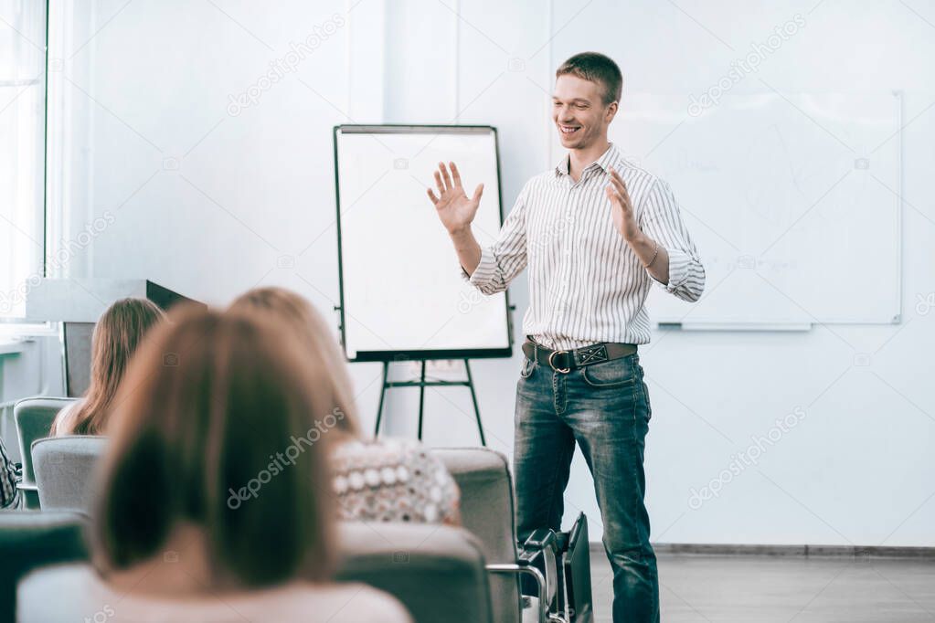 young employee explaining to colleagues his new ideas