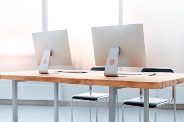 close up. workplace with computers on the table in an empty office.