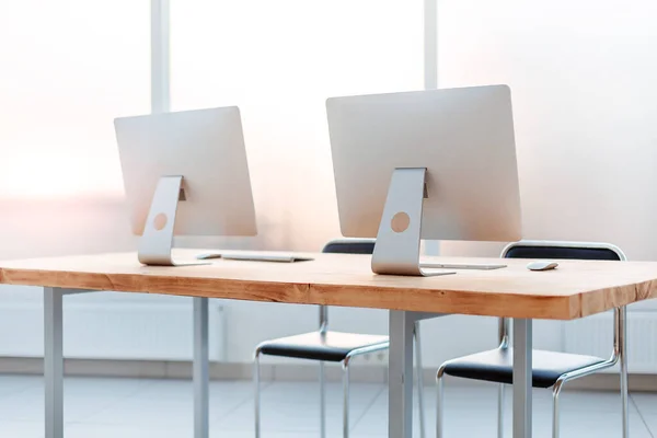 Close up. workplace with computers on the table in an empty office. — 图库照片