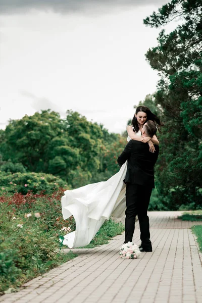 Beautiful couple in love on the blurred background of the city Park — Stock Photo, Image