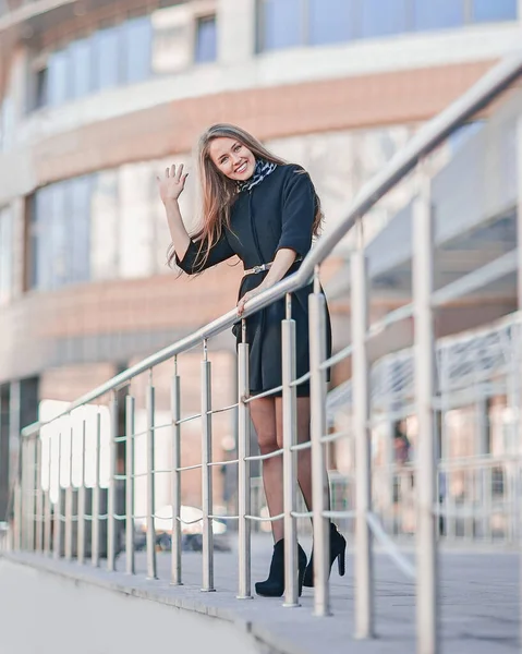 Modern business woman standing near modern office building — Stock Photo, Image