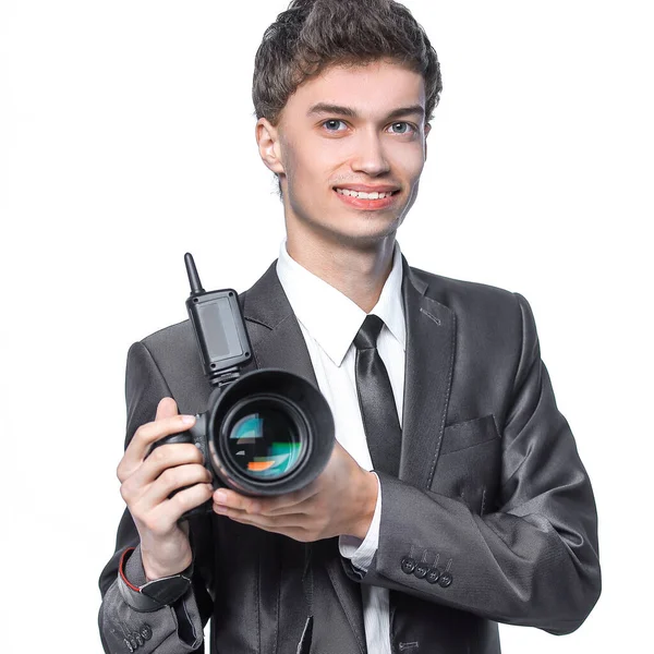 Porträtt av ung stilig fotograf som håller i kameran — Stockfoto