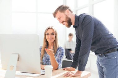 young employees discussing online news in the office