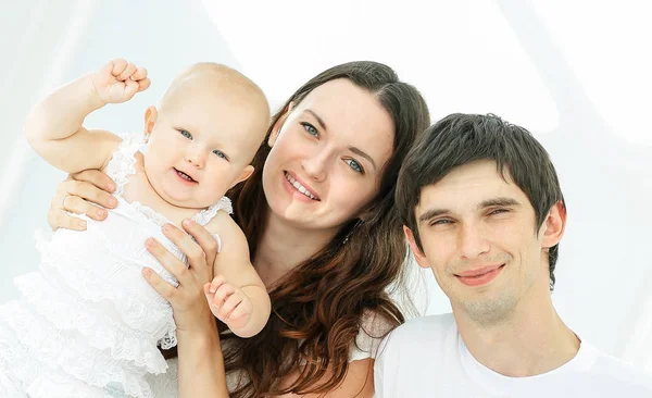 Modern happy family on a Sunday in the nursery — Stock Photo, Image