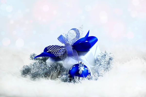 Christmas gift and blue balls on white background. — Stock Photo, Image