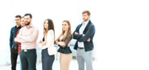 Blurred image for the advertising text. photo with copy space. confident business team standing in the office — ストック写真