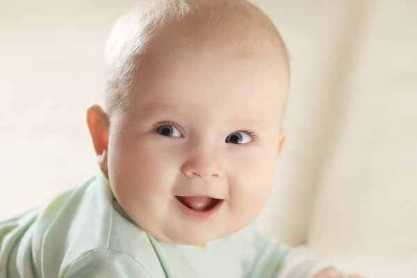 Close-up of a pretty little baby looking at the camera.photo wit — Stock Photo, Image