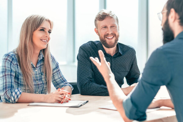 group of business people sitting at the office table.