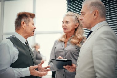 close up. the boss discusses the work plan with the employees