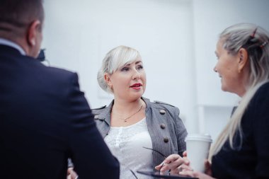 close up. businesswoman discussing something with her colleagues