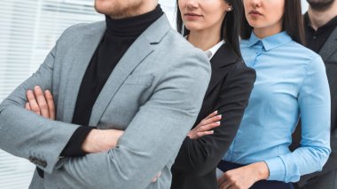successful businessman standing ahead of his business team