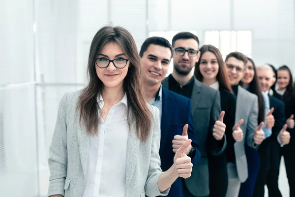 Group of young business people showing thumbs up — Stock Photo, Image