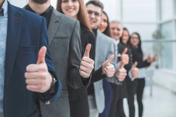 Large group of young entrepreneurs showing thumbs up — Stock Photo, Image