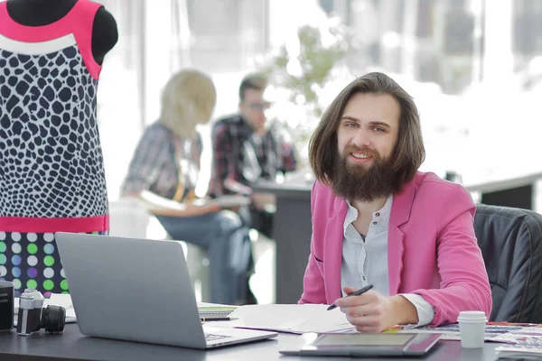 Fashion designer uses a graphic tablet sitting at a Desk in the Studio — Stock Photo, Image