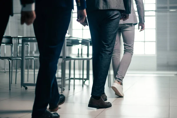 Close up. office employees passing to the workplace — Stock Photo, Image