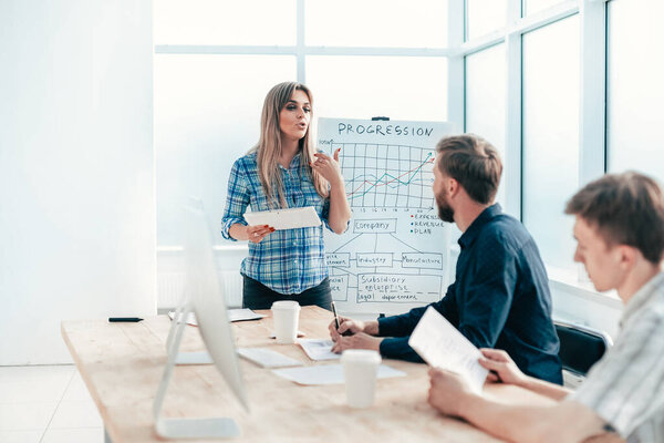 business woman at a meeting with the business team.