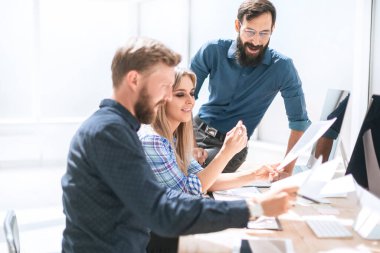 employees discussing documentation for a new project