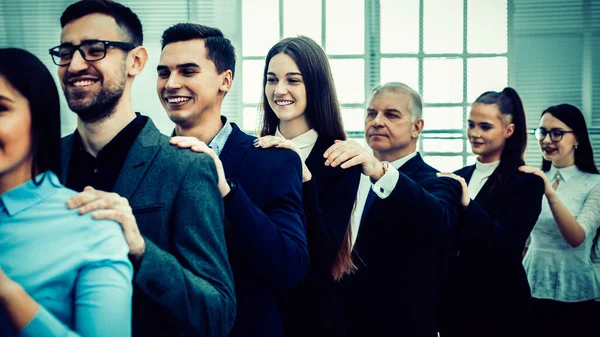 Group of corporate employees standing behind each other. — Stockfoto