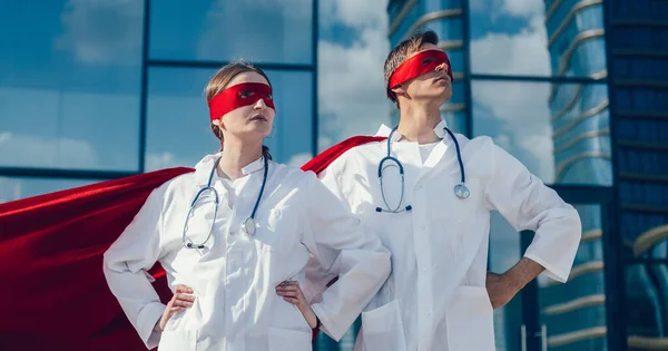 close up. doctors are superheroes standing on a city street .