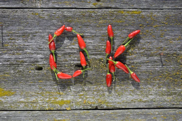 Word ?OK? made of hot chili peppers — Stock Photo, Image