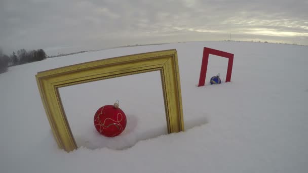 Field with Christmas baubles in frames, time lapse 4K — Stock Video